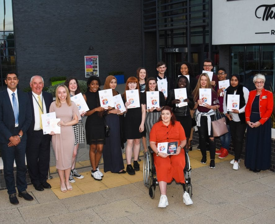 group shot of V6 student star award winners facing with principal, corporation chair and guest speaker