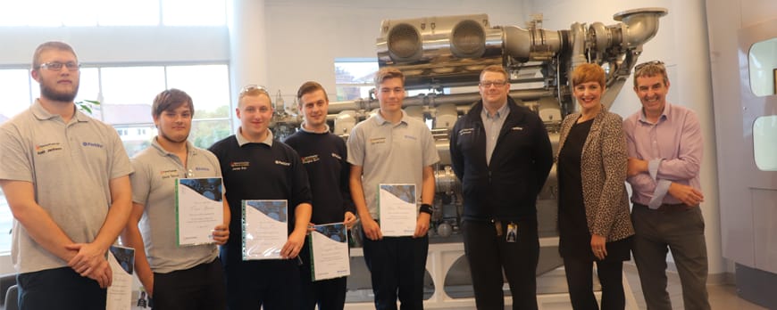 group shot of graduating engineering apprentices facing