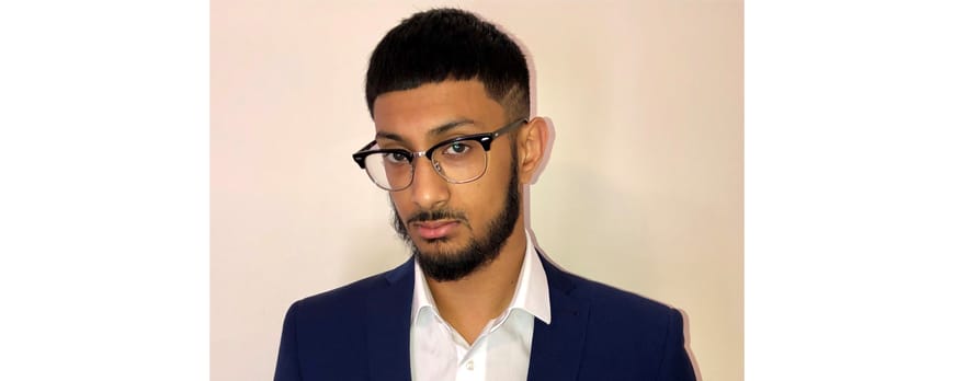 male business student head and shoulder shot facing