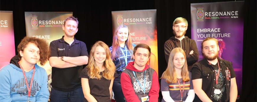 group shot of Resonance representatives with music students