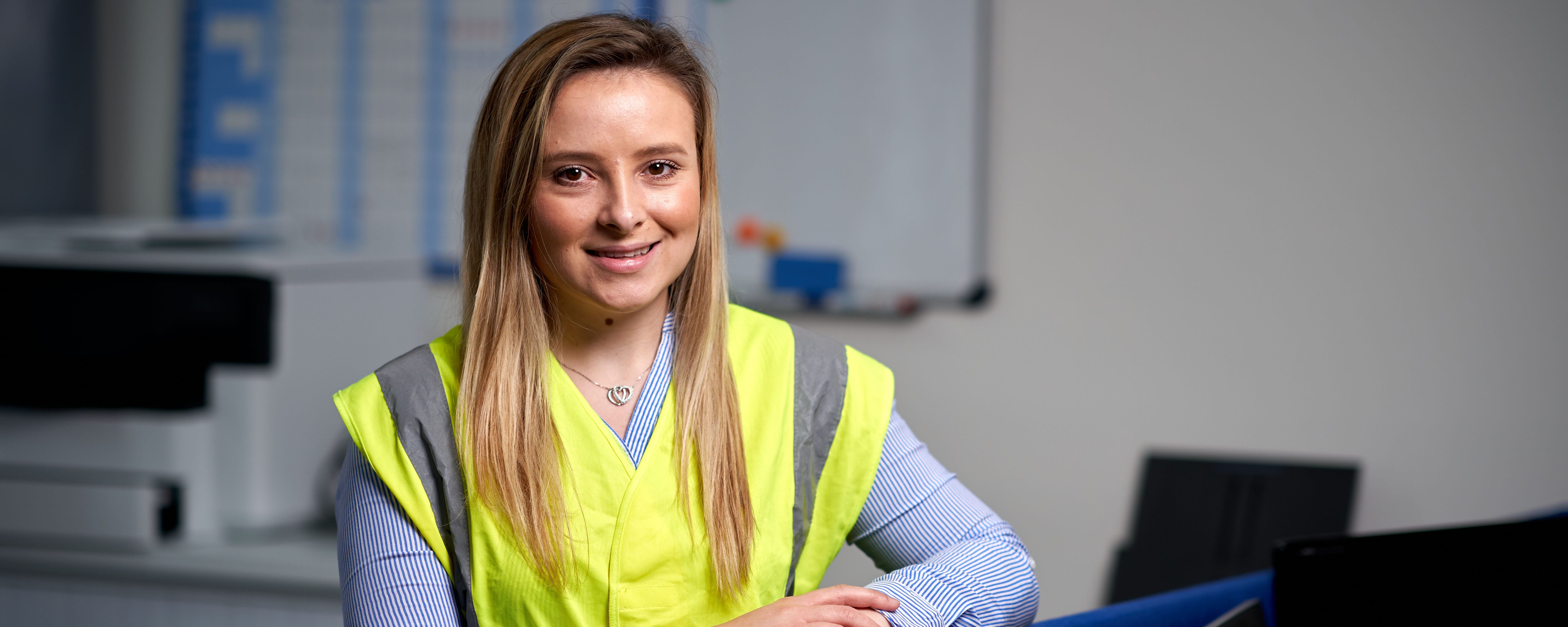 female student in hi vis facing