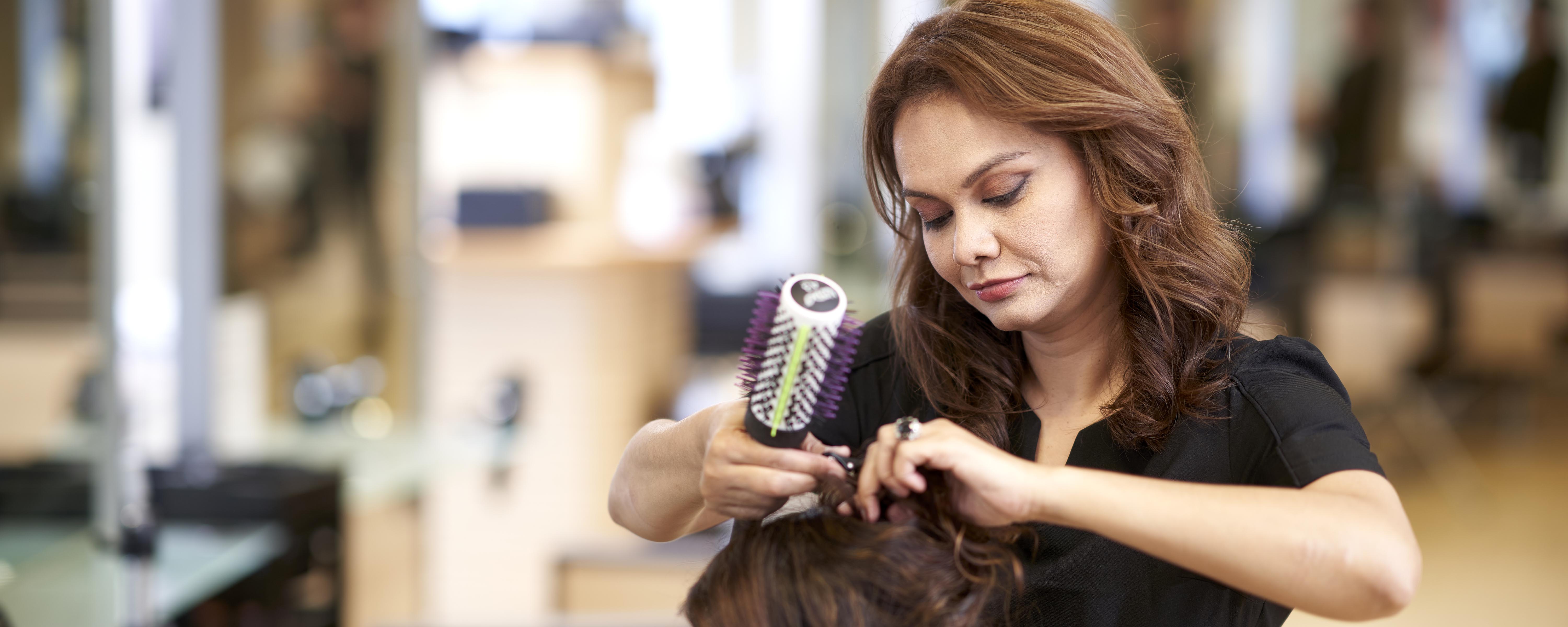 Hair stylist styling hair