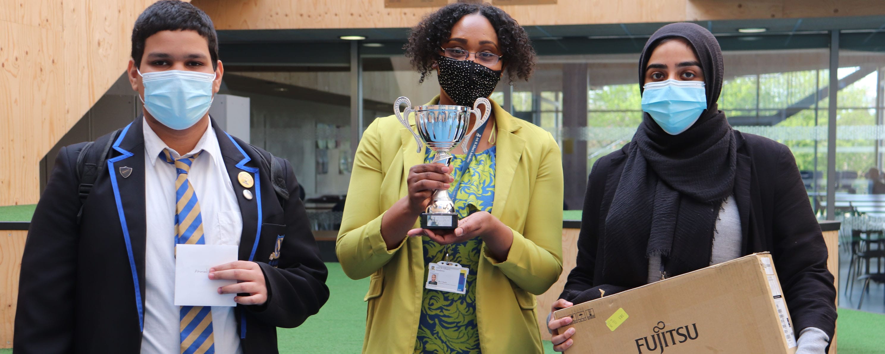 group shot of St Albans Academy digital competition winners in face masks facing