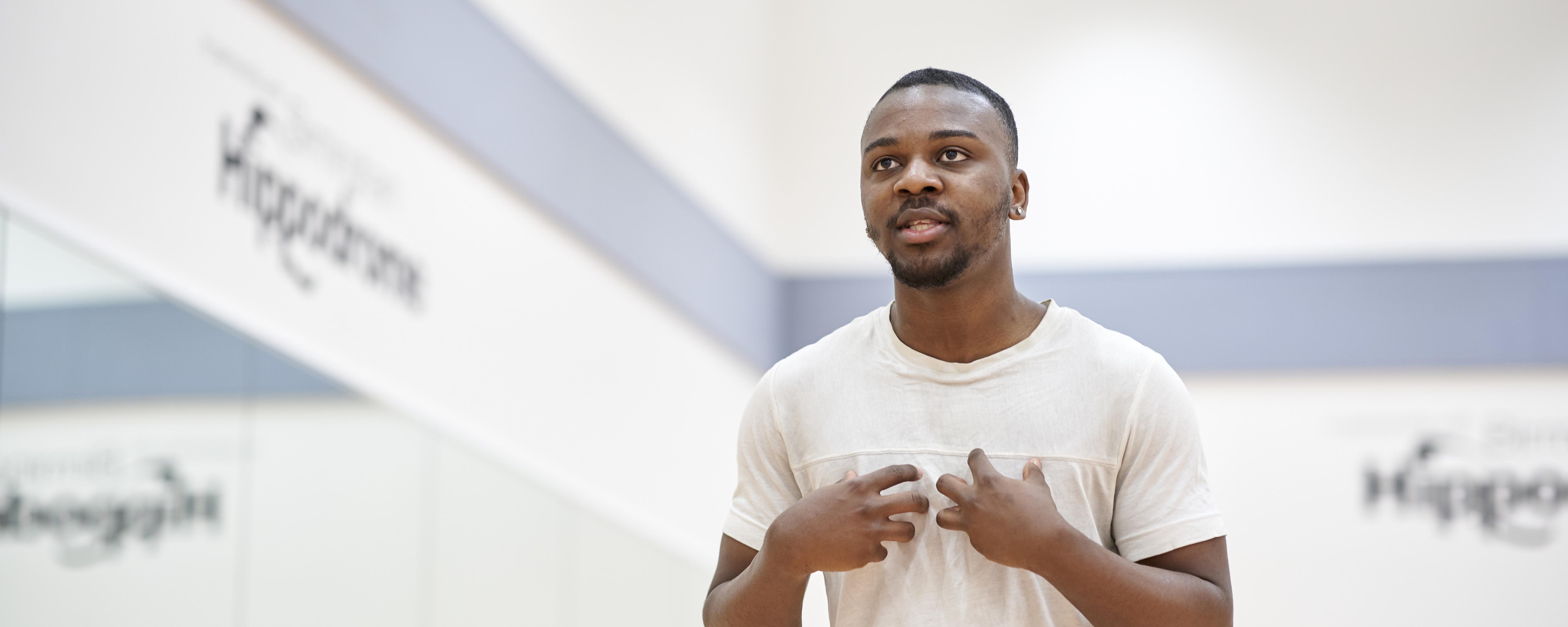 male acting student in studio rehearsal room performing dialogue