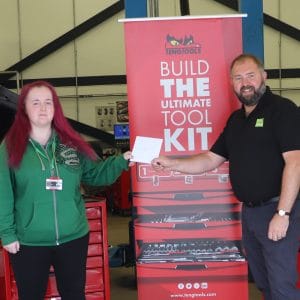female automotive students receives competition prize from Autotech representative