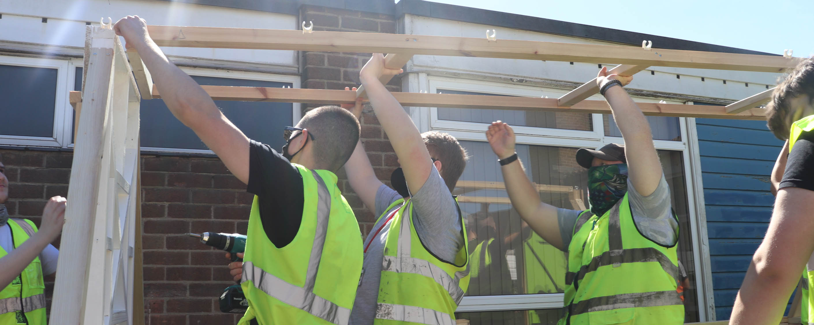 carpentry students installing polytunnel