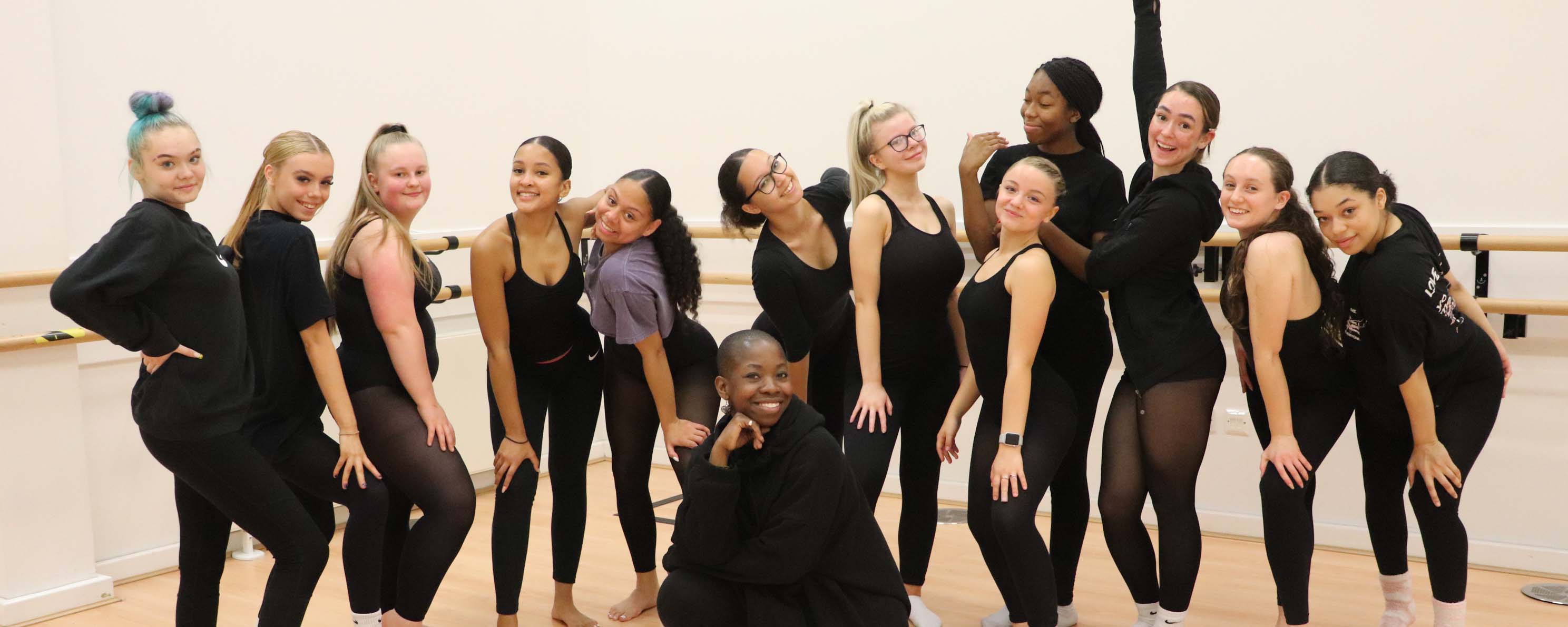 group shot of student dancers posed facing