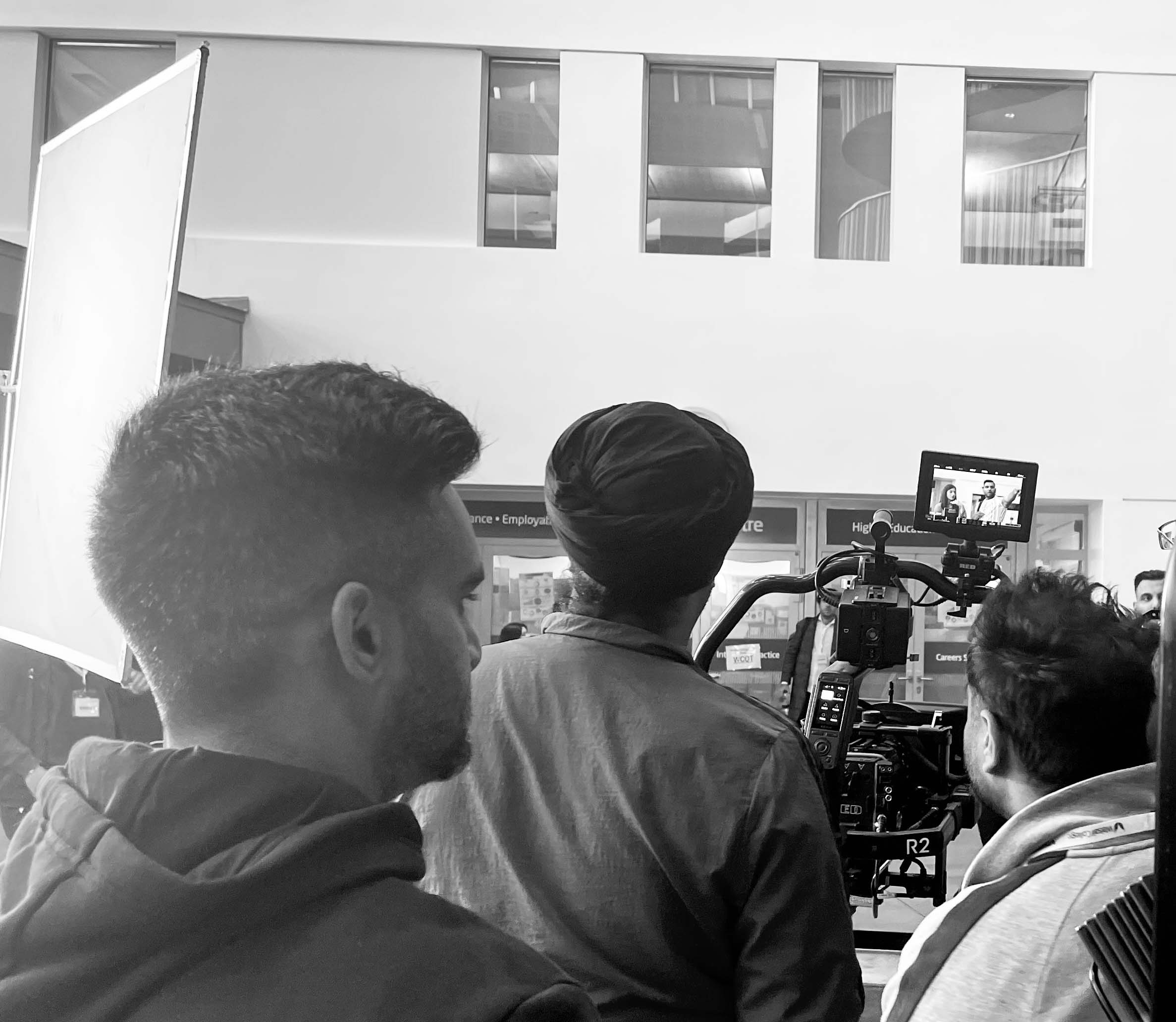 film crew at work in college atrium