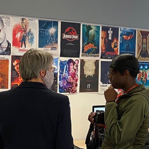 AoC Deputy Chief Executive. speaks to media student in media classroom