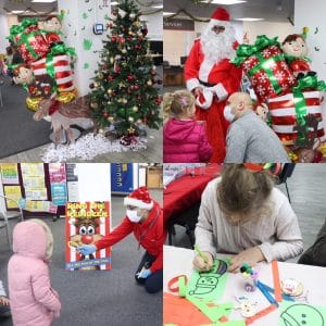 plastic reindeer, Christmas tree, parent and child talking to Santa, chil d colouring in snowman template drawing and child playing ring the reindeer game