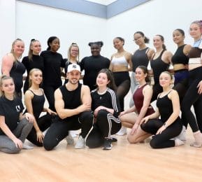 dance students pose with show choreographer - group shot