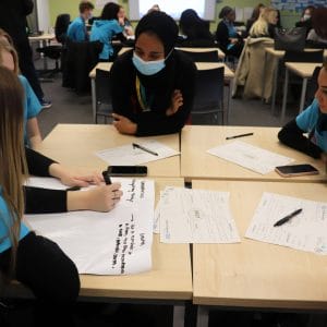 Walsall Manor Hospital staff member in classroom conversation with Health T Level students