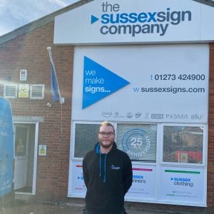 Apprentice outside the sussexsign company facing