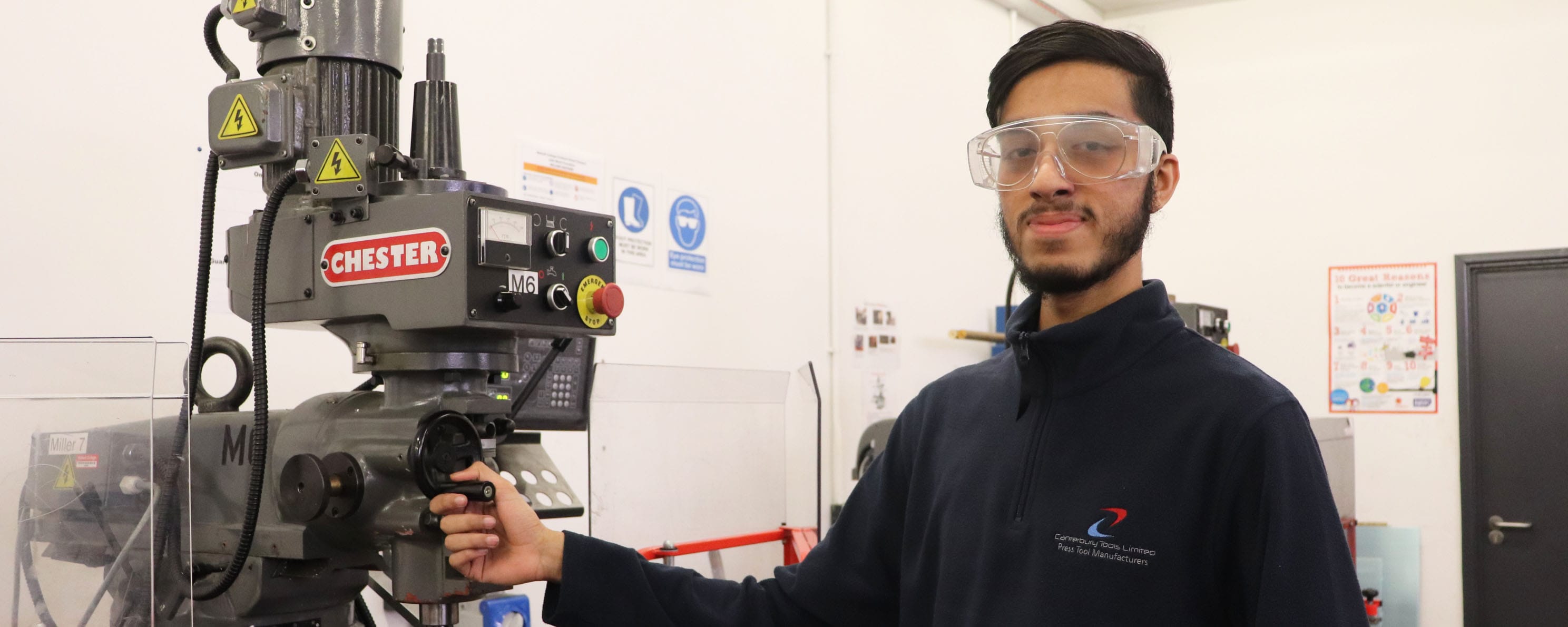 engineering apprentice in workshop facing