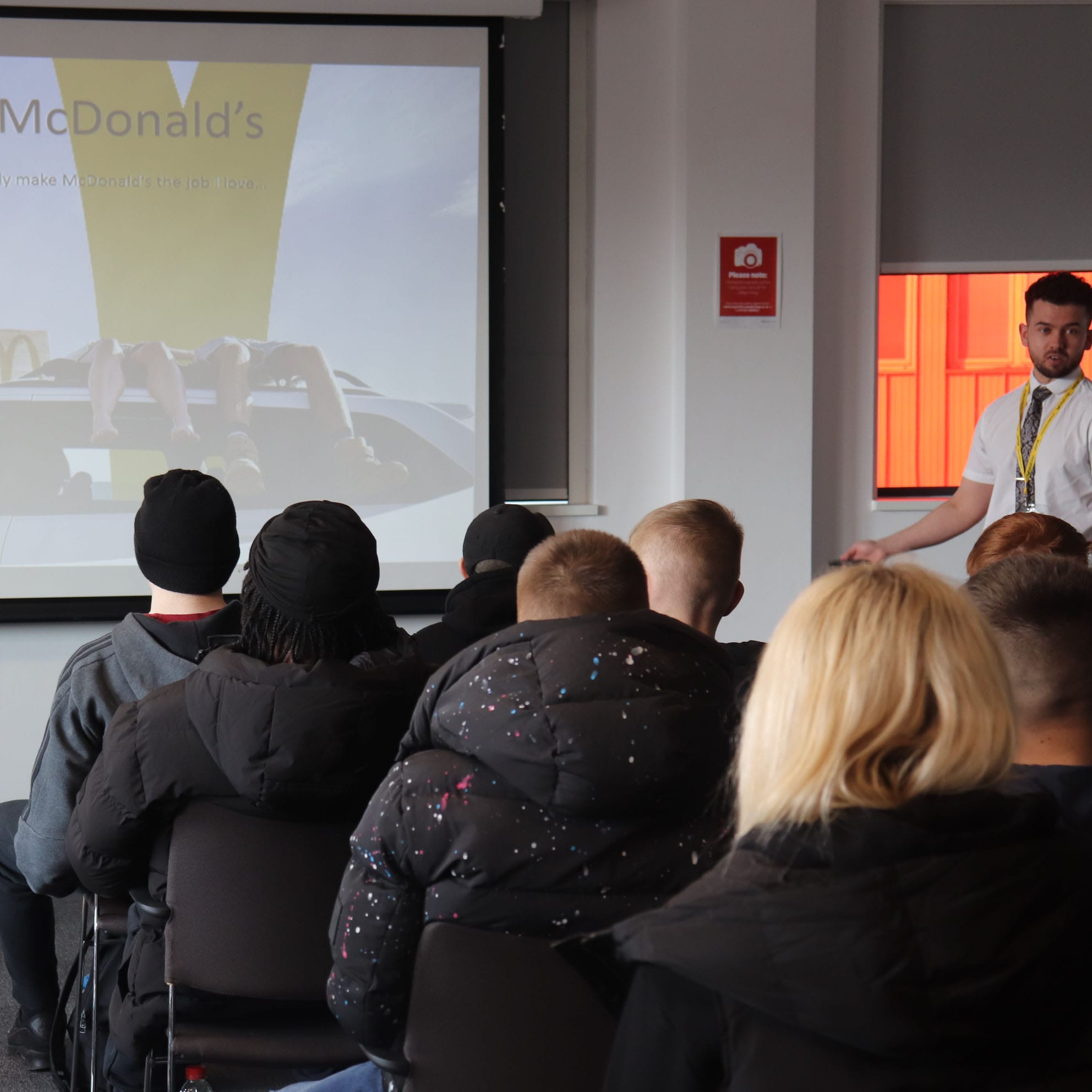 McDonalds representative addresses audience during workshop
