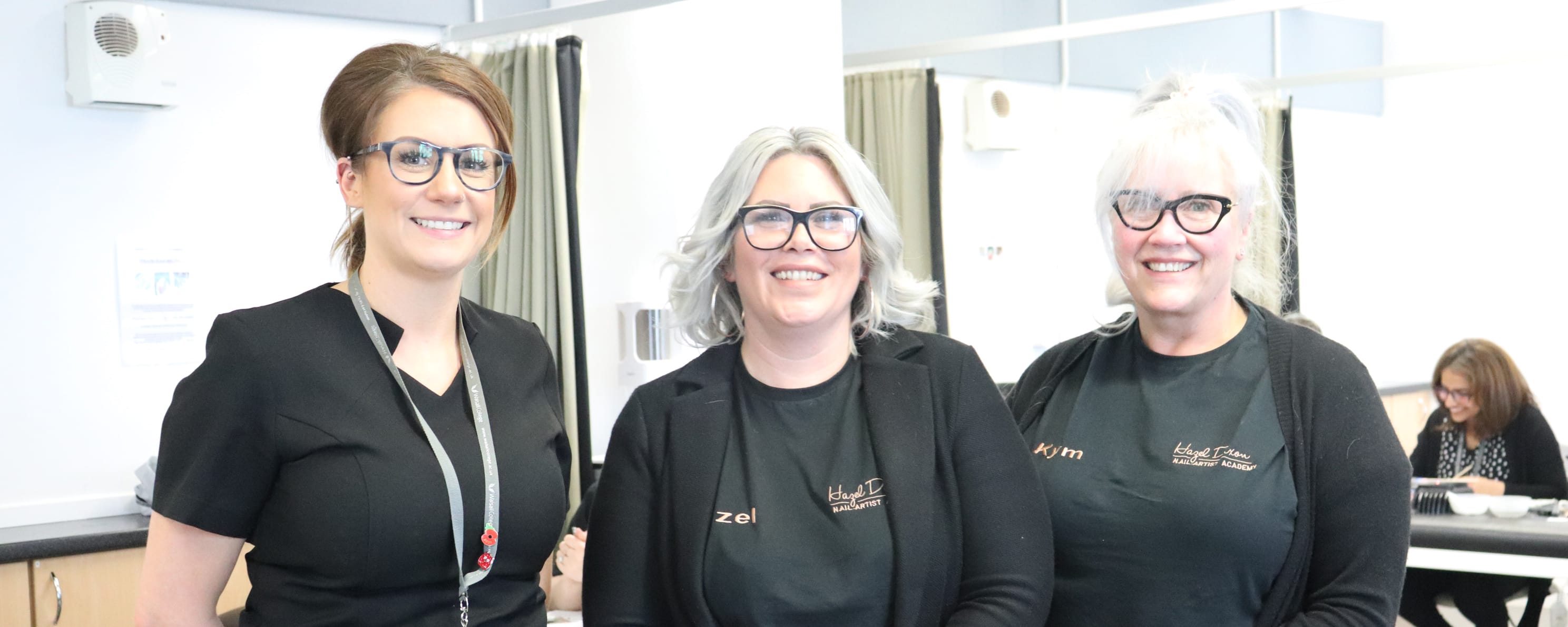 two female HD Professional Nail Systems representatives with female beauty lecturer