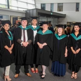 teacher education graduates group shot facing