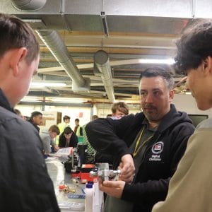 plumbing industry representative demonstrates equipment to students