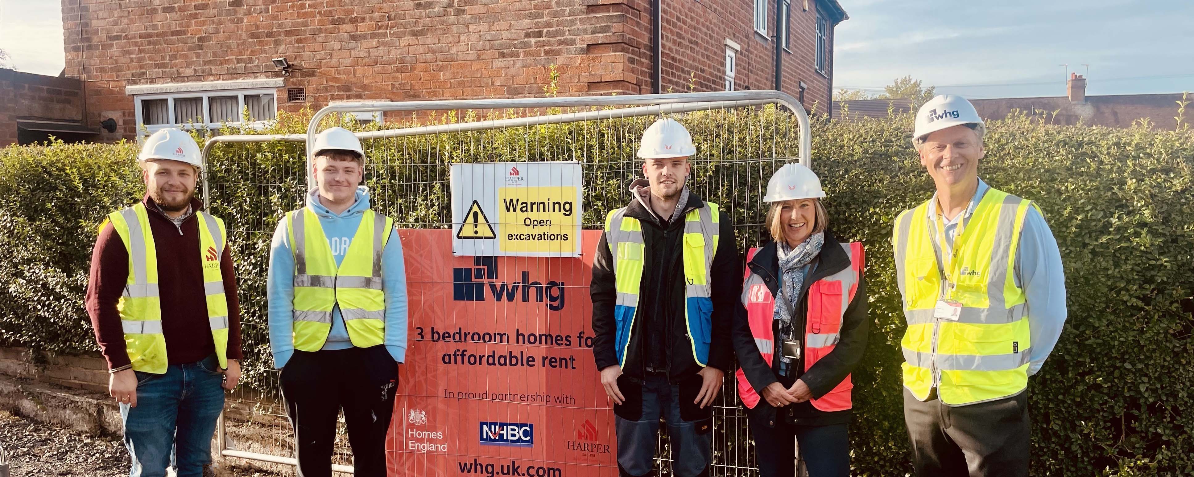 bricklaying students on site with Harper Group representatives