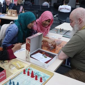 two students play boardgame