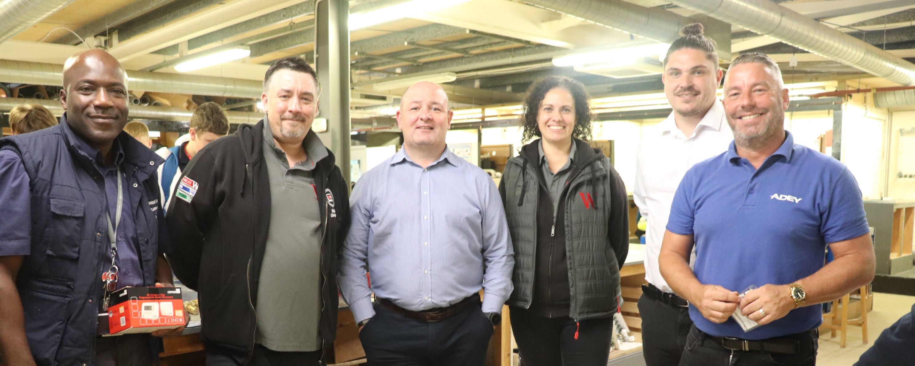 plumbing industry representatives group shot with college lecturer