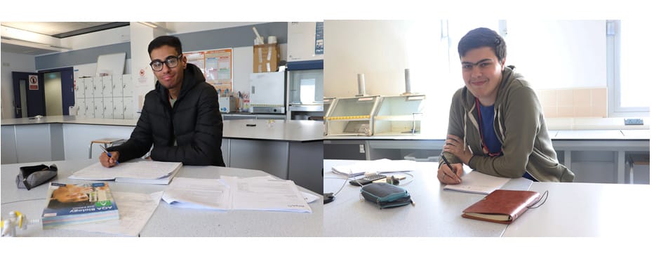 science students Ismail and Rex studying in science lab facing