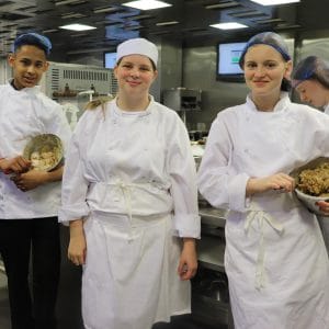hospitality students in kitchen facing