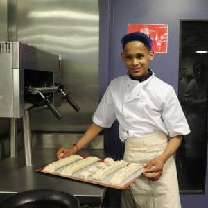 hospitality student in kitchen facing