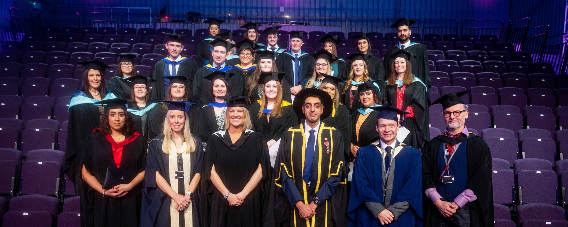 Apprentices and work-based learners Class of 2022 on stage at Higher Education Ceremony