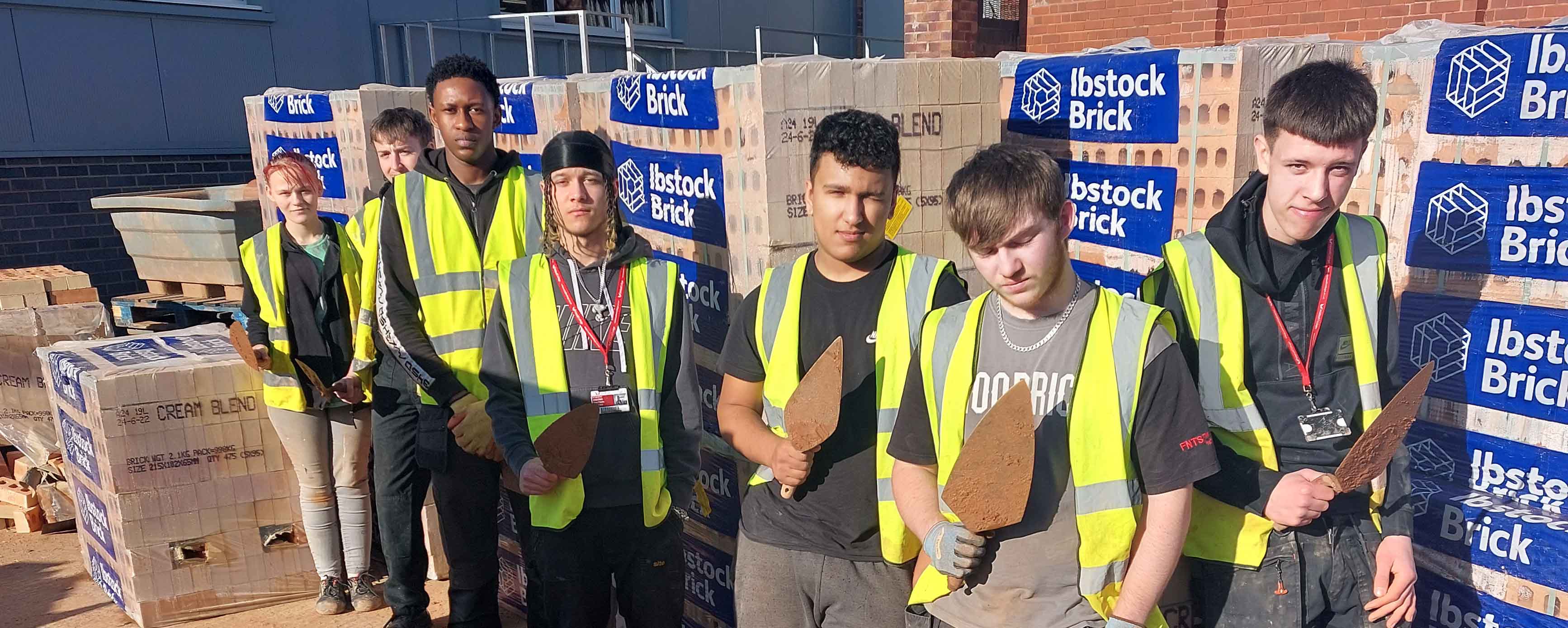 student using bricks donated by Ibstock Bricks