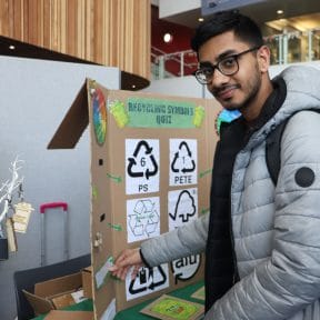 student at recycling symbols quiz