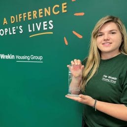 Trish poses with her award