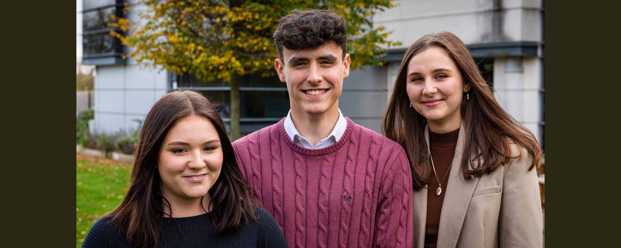 two female and one male construction T level students facing