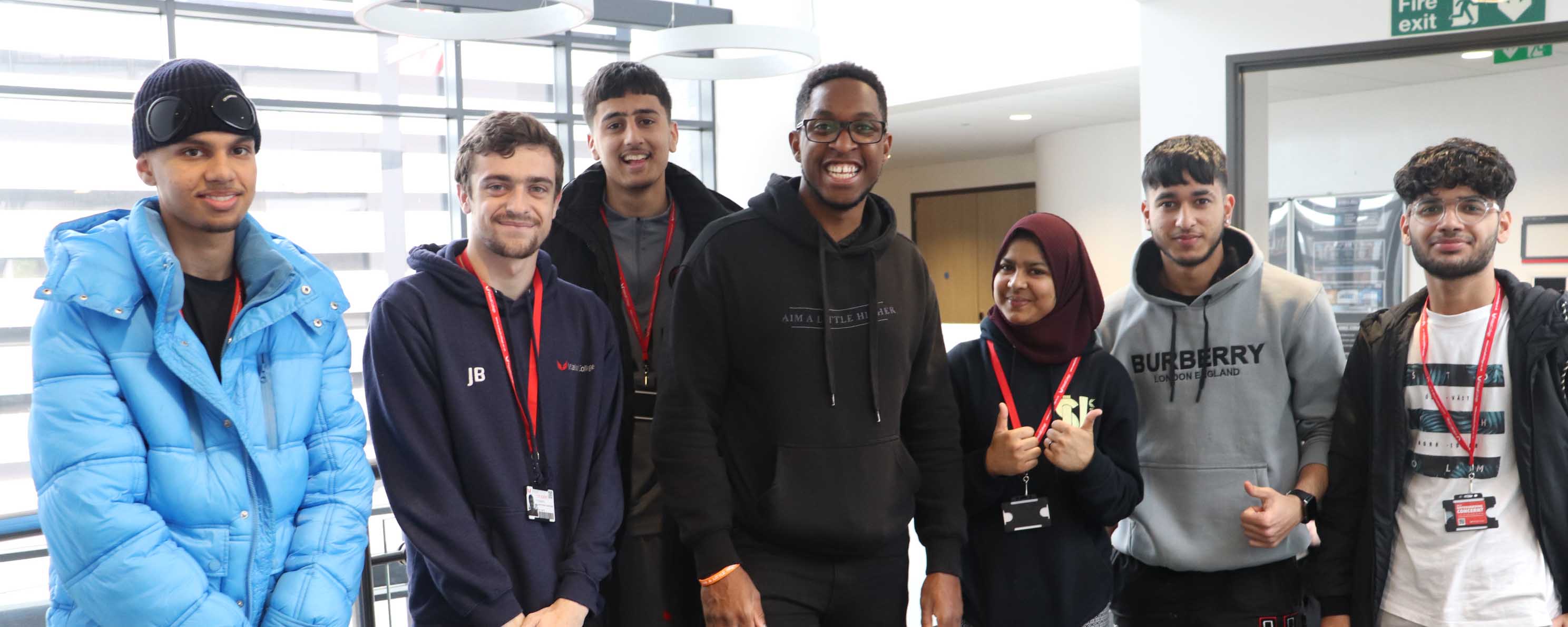 group shot of students with event guest speaker facing