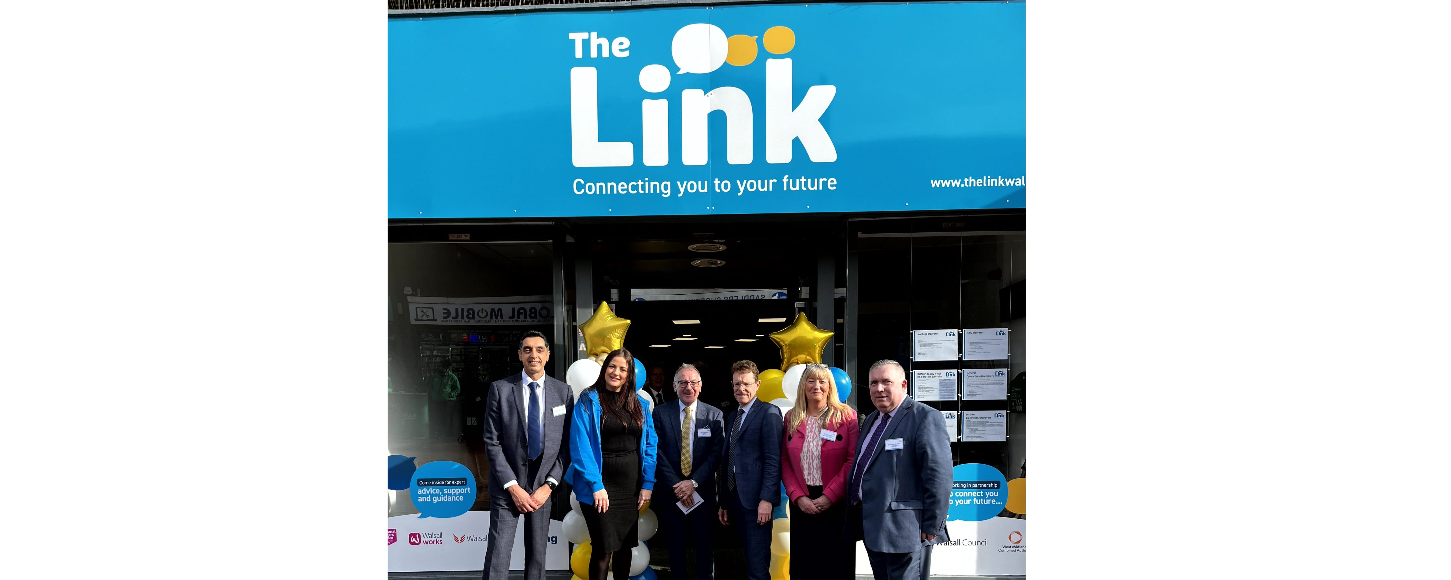 group shot of stakeholders with Mayor outside premises