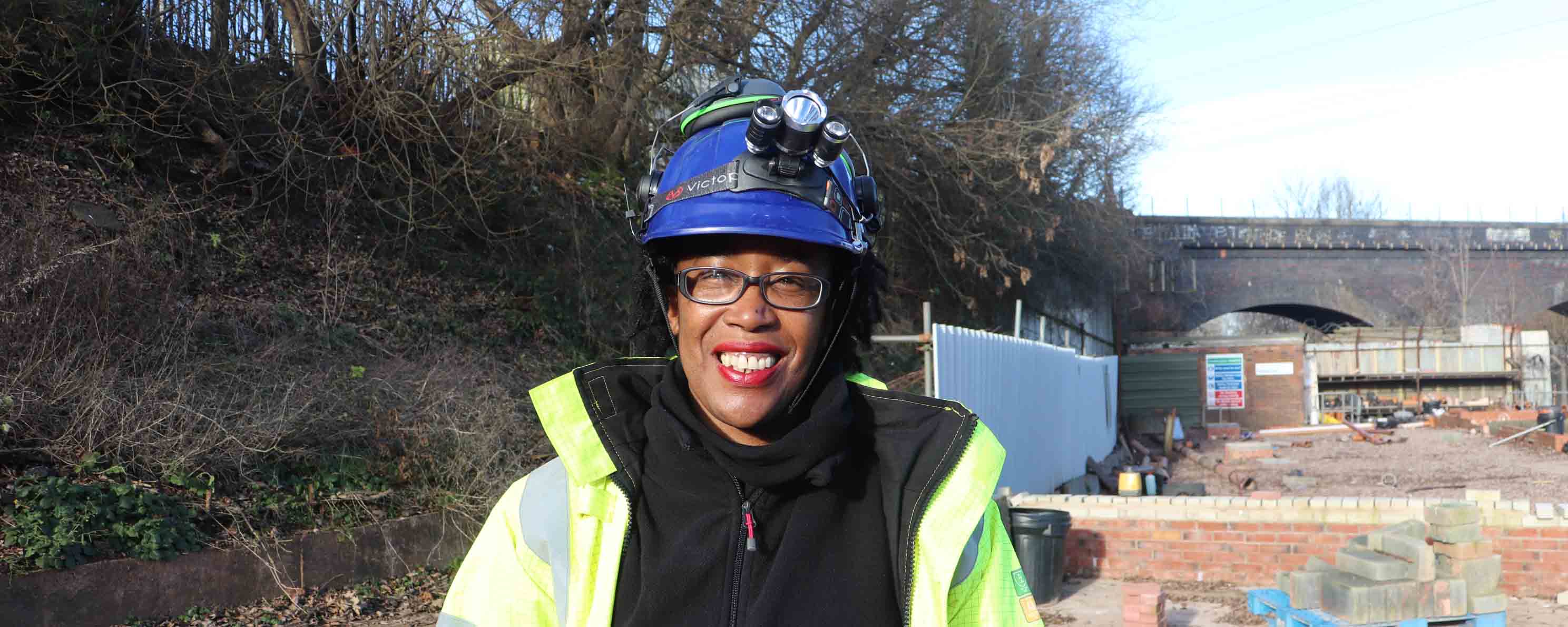 female construction apprentice facing
