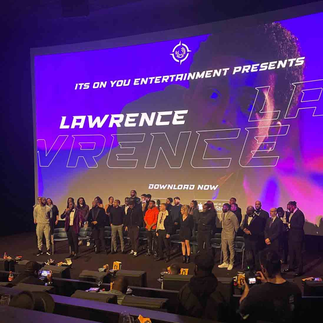 group shot of individuals on stage facing audience