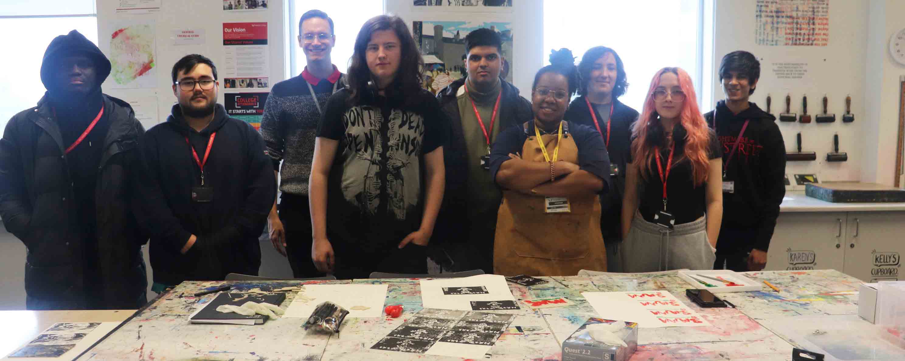 group shot of art students and artist in workshop