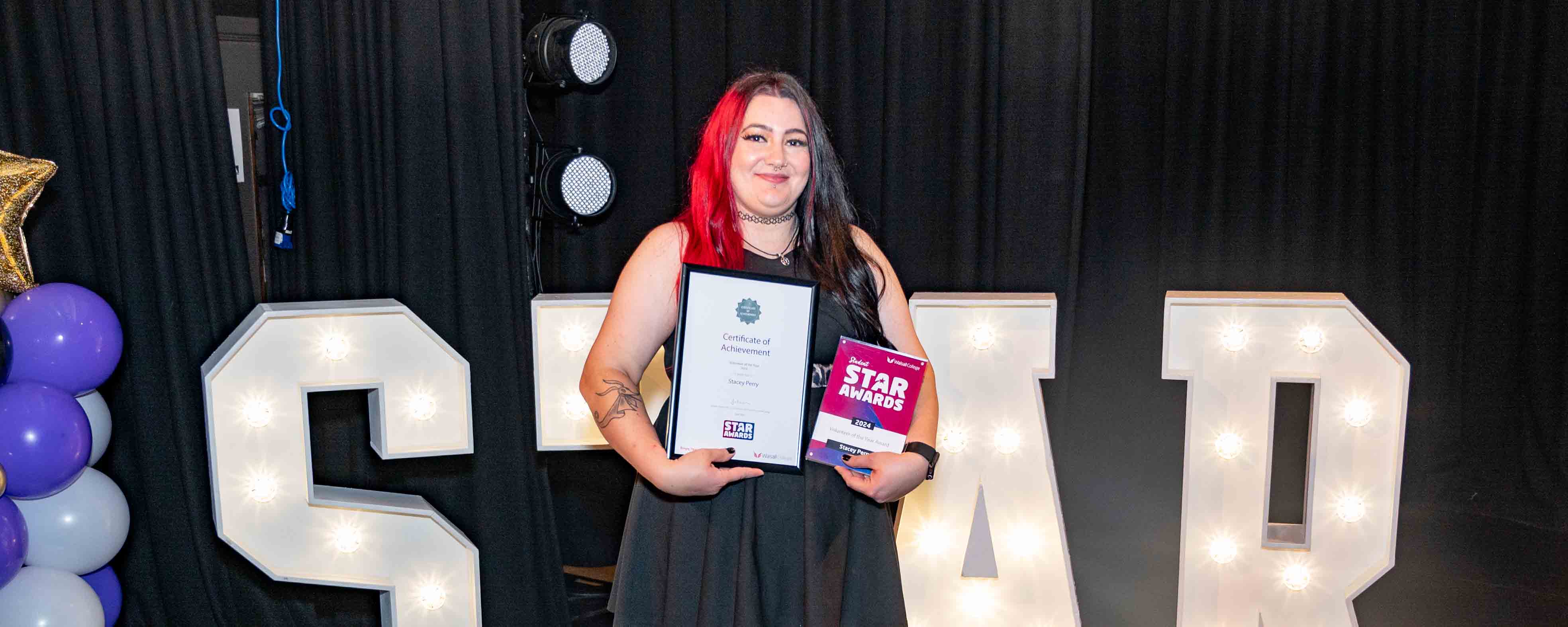 adult female student with awards facing
