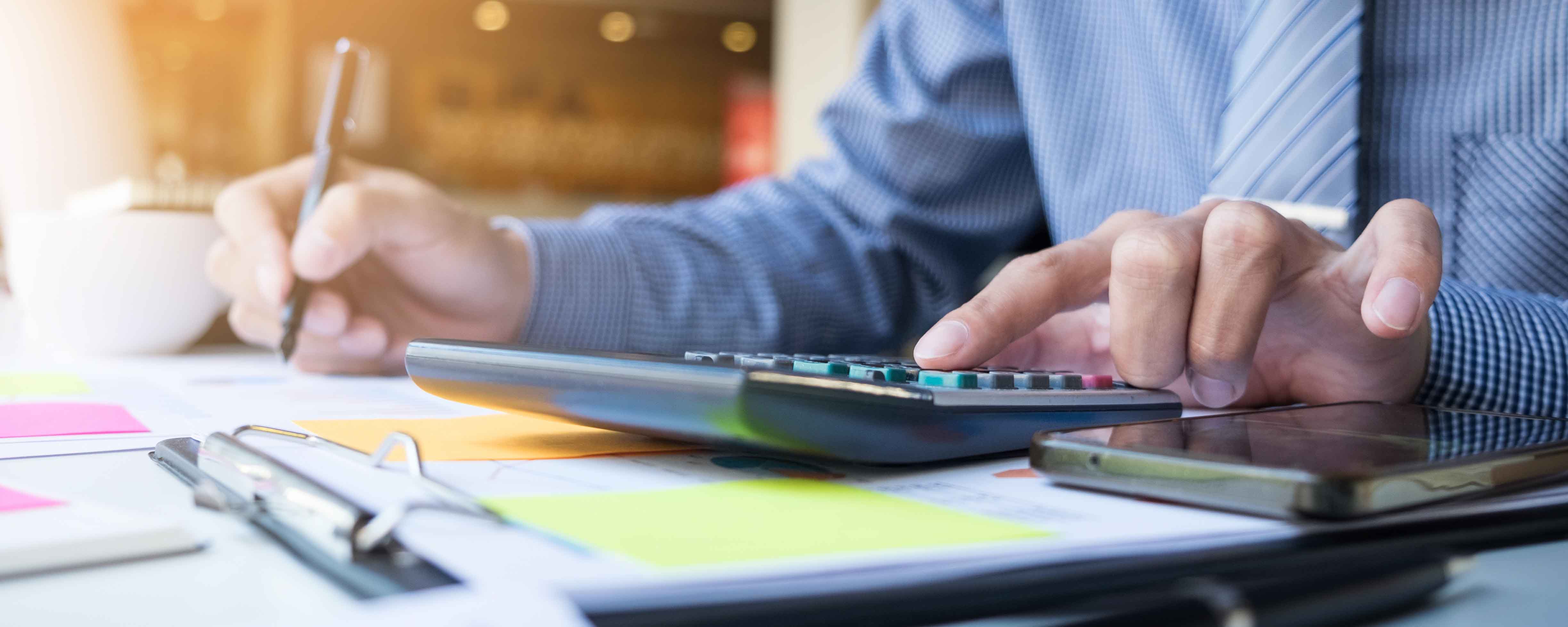Business finance man calculating budget numbers, Invoices and financial adviser working.
