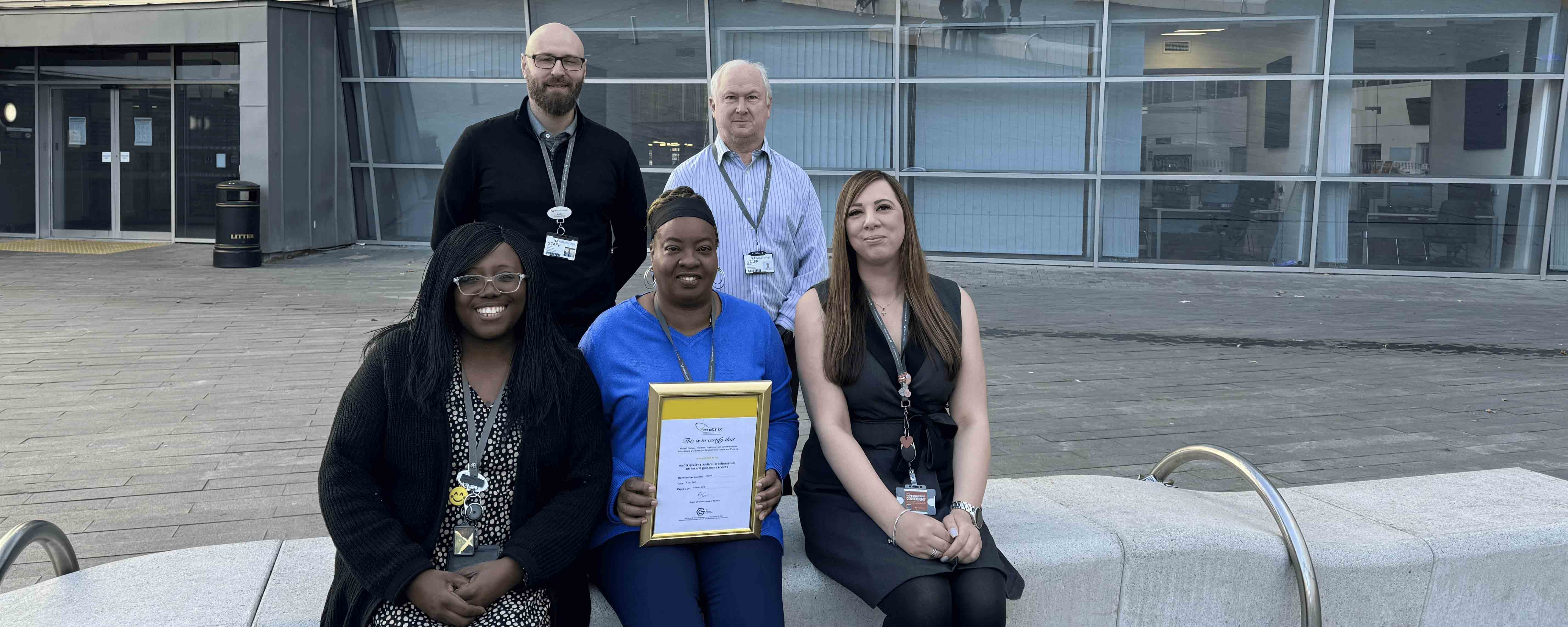 staff group shot with award