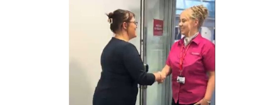female employer shakes hands with female job candidate