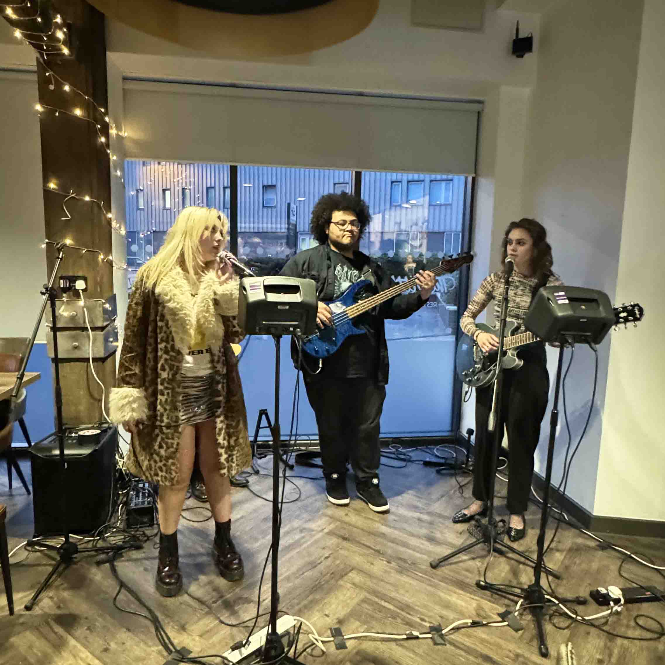 three student musicians in performance