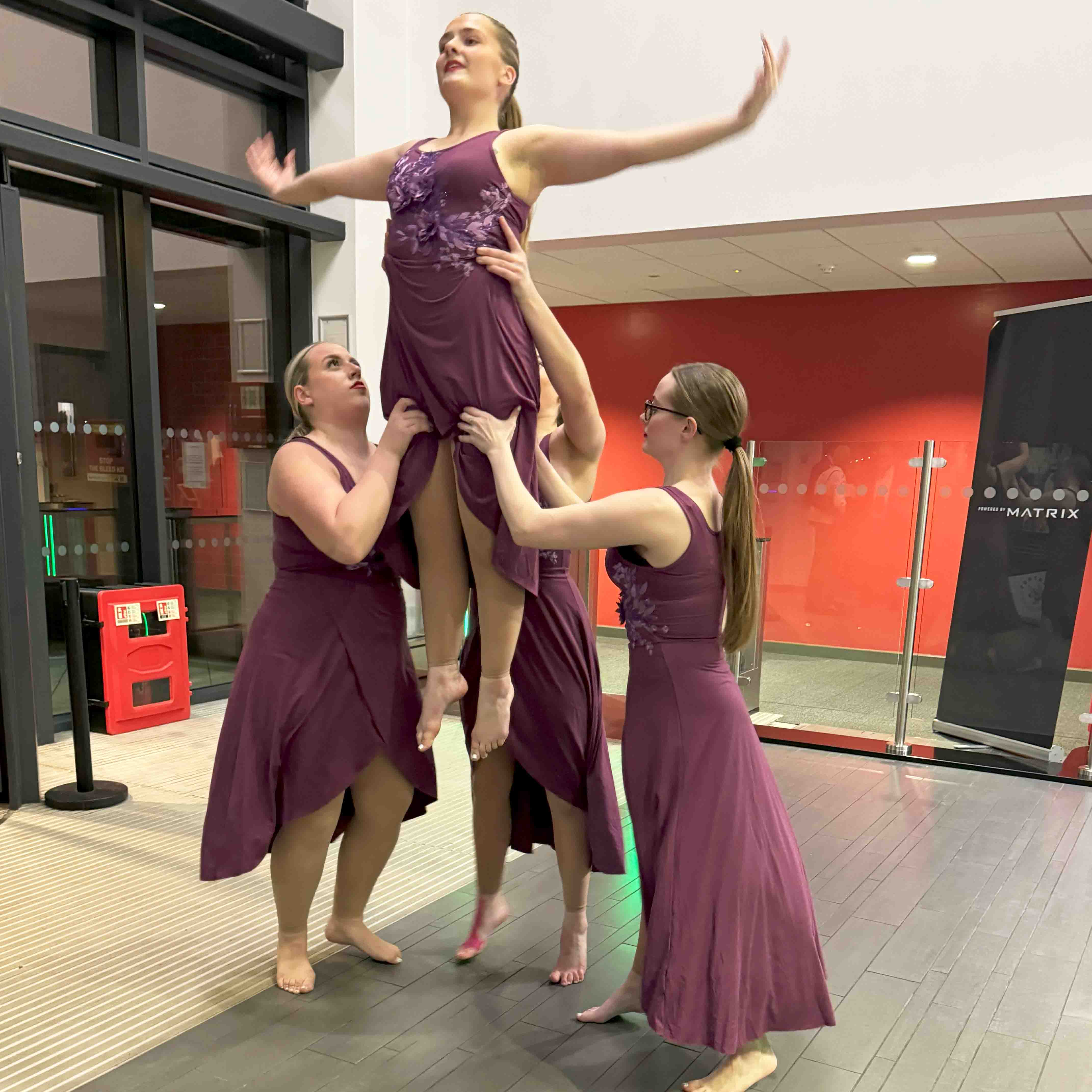 three student dancers in performance